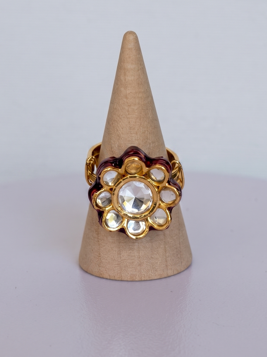 Handcrafted adjustable Kundan ring made in India with crystal-inspired floral detailing, luminous center stone, and radiant 22Kt gold plating.