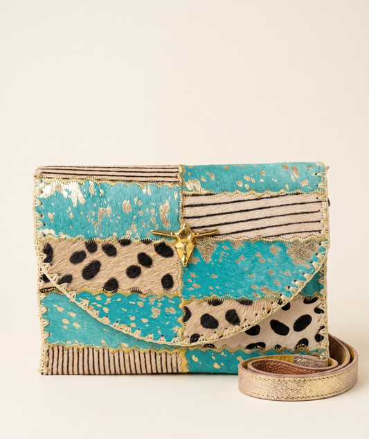 Designer handbag with leopard print and gold accents on a beige background