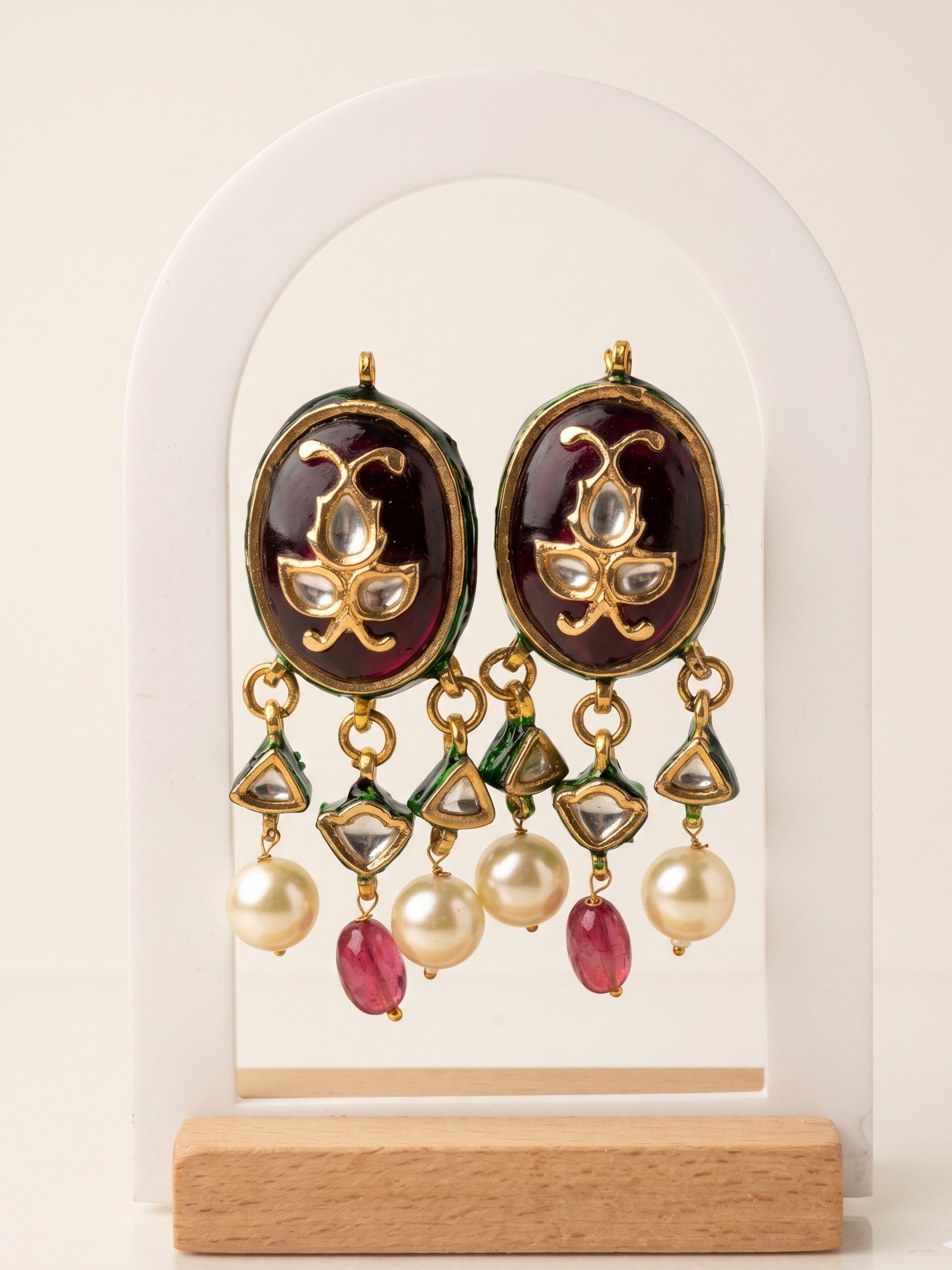 Ornate earrings with gemstones on a white background