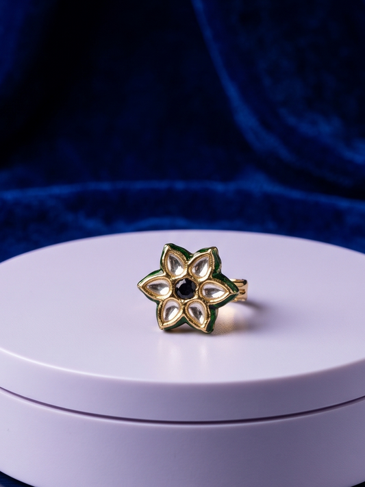 Elegant handcrafted Kundan ring featuring a deep black center stone, floral crystal-inspired detailing, and radiant 22Kt gold plating designed for timeless sophistication.