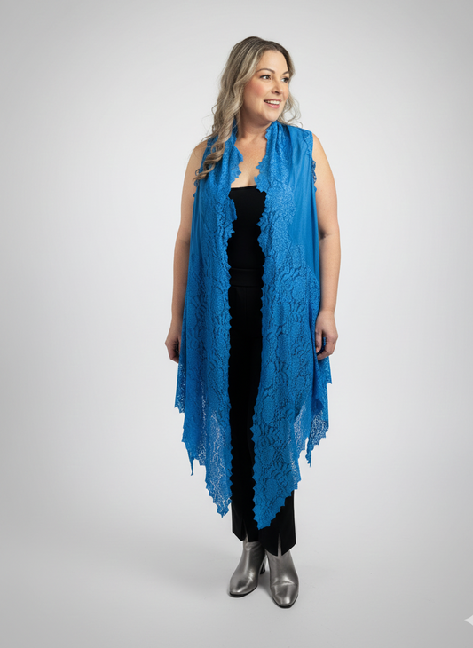 Woman wearing a blue lace scarf on a gray background