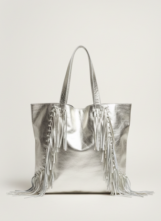 Silver handbag with fringe details on a white background